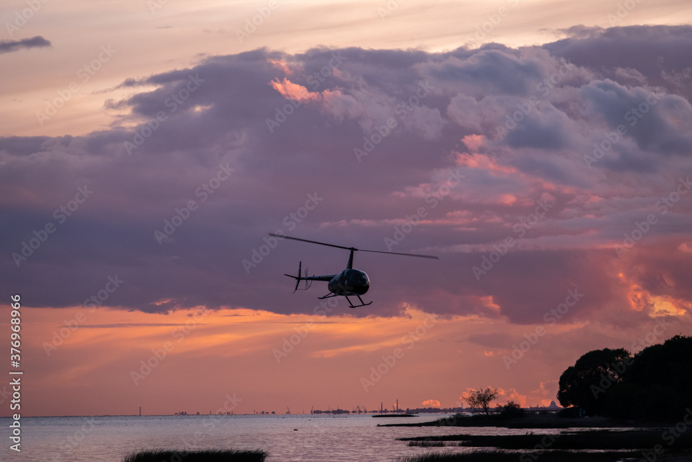 The helicopter flies in the sky The helicopter flies in the sky