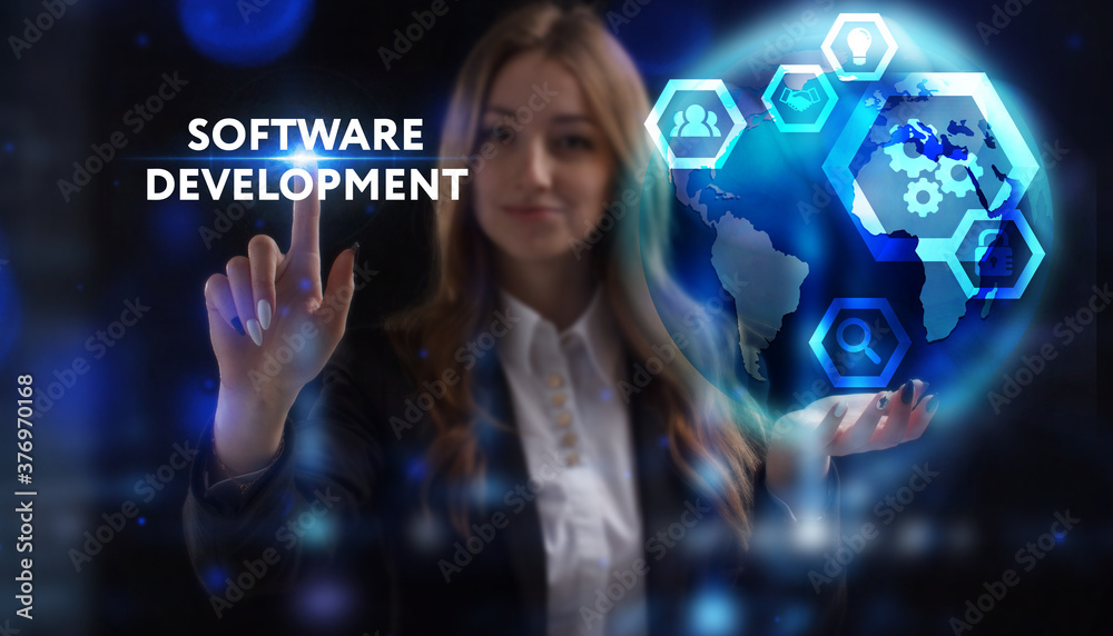 Business, Technology, Internet and network concept. Young businessman working on a virtual screen of the future and sees the inscription: Software development Business, Technology, Internet and network concept. Young businessman working on a virtual screen of the future and sees the inscription: Software development