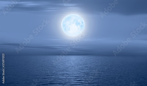Night sky with moon in the clouds  Elements of this image furnished by NASA
