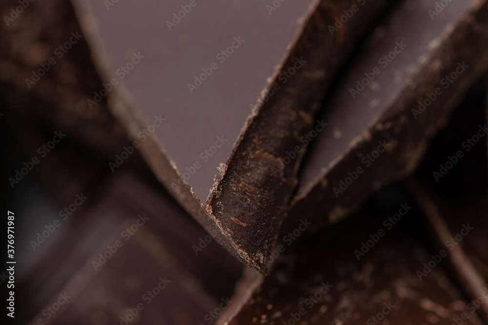 Dark chocolate cracked pieces closeup macro Dark chocolate cracked pieces closeup macro