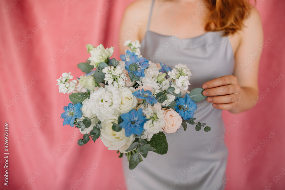 Large Beautiful bouquet of mixed flowers in woman hand. Floral shop concept . Beautiful fresh cut bouquet. Flowers delivery Large Beautiful bouquet of mixed flowers in woman hand. Floral shop concept . Beautiful fresh cut bouquet. Flowers delivery
