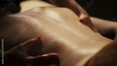 Wallpaper Mural Young woman has massage. Authentic footage of luxury spa treatment. Deep tissue back massage close up. Slow motion. Torontodigital.ca