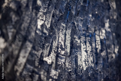 Titanium metallurgy. Crushed titanium metal sponge close-up. Low depth of field. photo