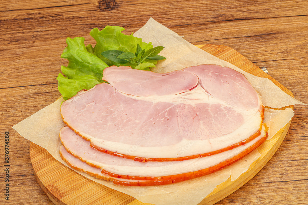 Sliced pork belly over board