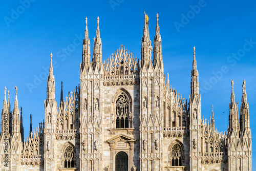 Wallpaper Mural Facade of the Cathedral of Milan with blue sky and statues pillars Torontodigital.ca