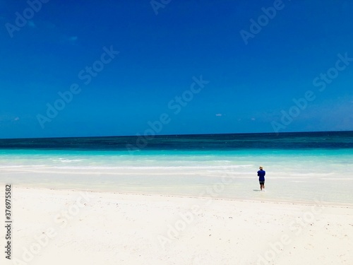 man walking on the beach