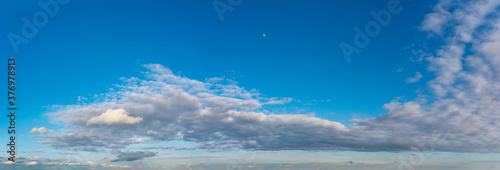 Fantastic clouds against blue sky, panorama © StepStock