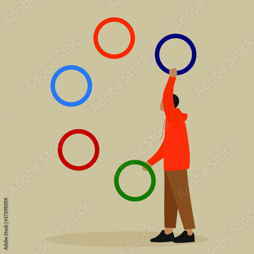 Man juggles with multi-colored rings