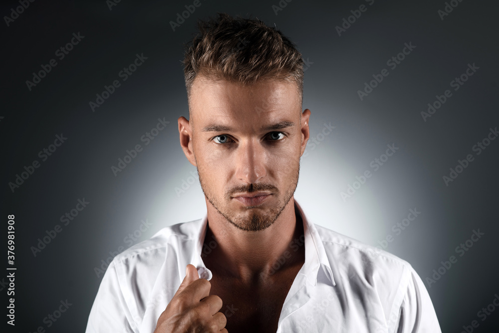 portrait of a handsome man in a white shirt in the studio portrait of a handsome man in a white shirt in the studio