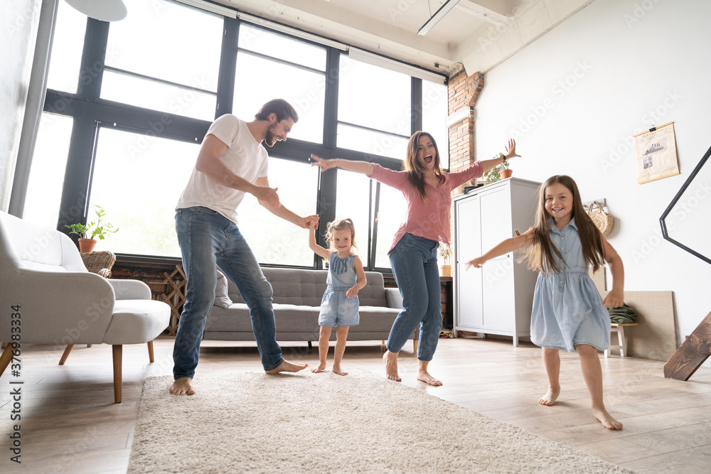 happy family mother father and child daughter dancing at home happy family mother father and child daughter dancing at home