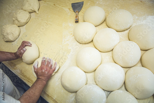 Only Hands Shaping Dough at a Bakery in Belgrade, Serbia photo