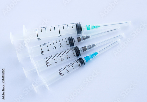 Syringes. Medical equipment. Pharmacy. Medical products. Syringes of different volumes. Concept - vaccination. Production of medical devices