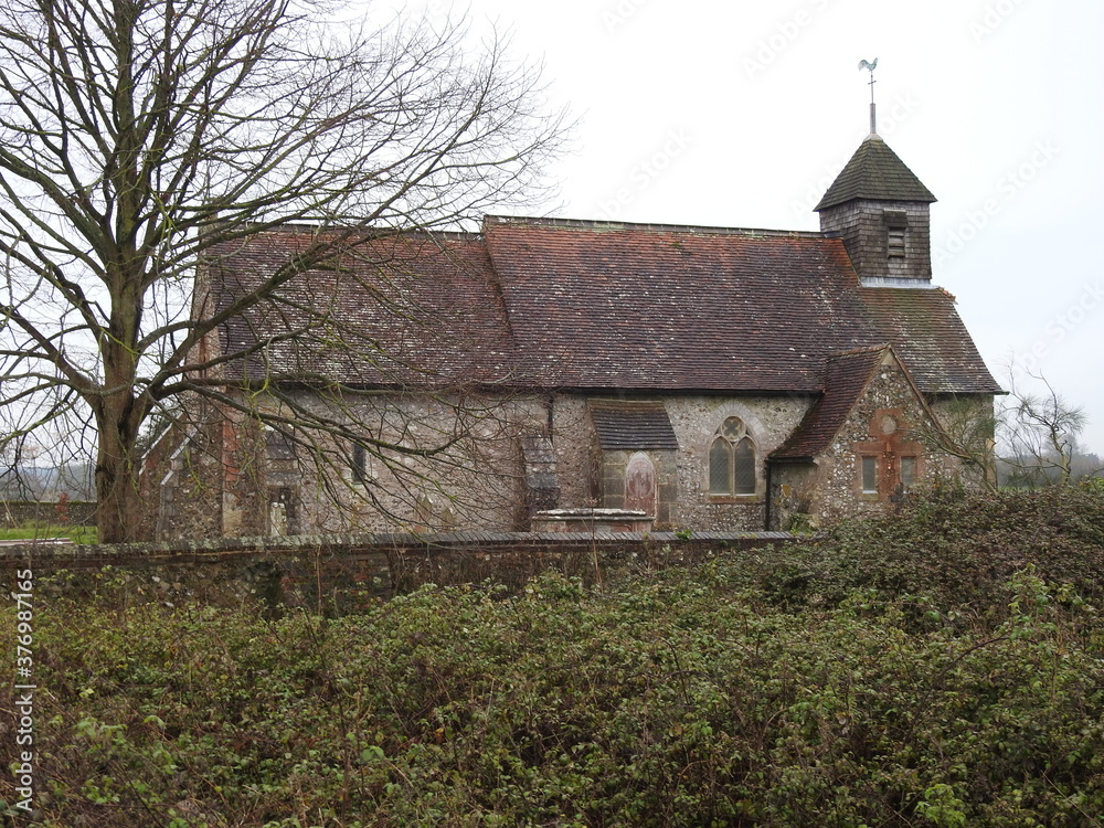 View of the old walled church with a cemetery