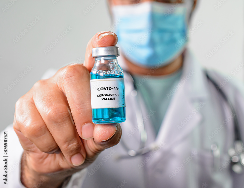 Doctor holds in hand a Coronavirus vaccine that is used for the prevention, immunization and treatment of Coronavirus - Covid-19