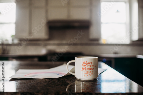 Motivational coffee cup sitting on kitchen counter