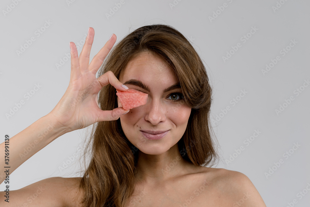 Beautiful young woman with watermelon over white background Beautiful young woman with watermelon over white background