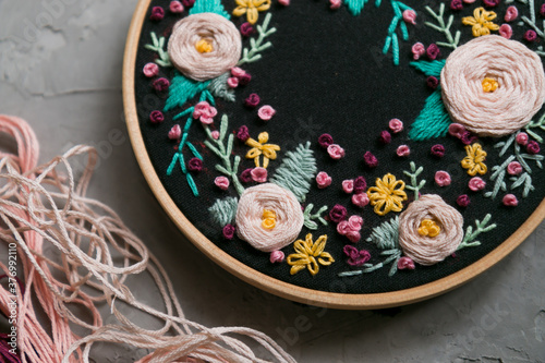 Floral embroidery on a concrete background 
