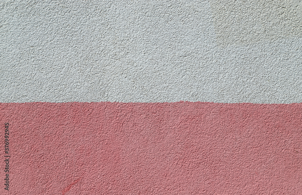 Fototapeta premium Texture of the decorative plasterwork painted in pink and white colors