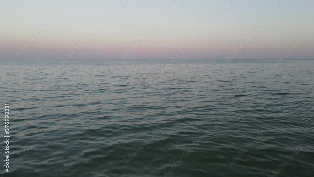 Aerial view over sea or ocean. Landscapes view of endless sea water and sky in summer day. Aerial view over sea or ocean. Landscapes view of endless sea water and sky in summer day.