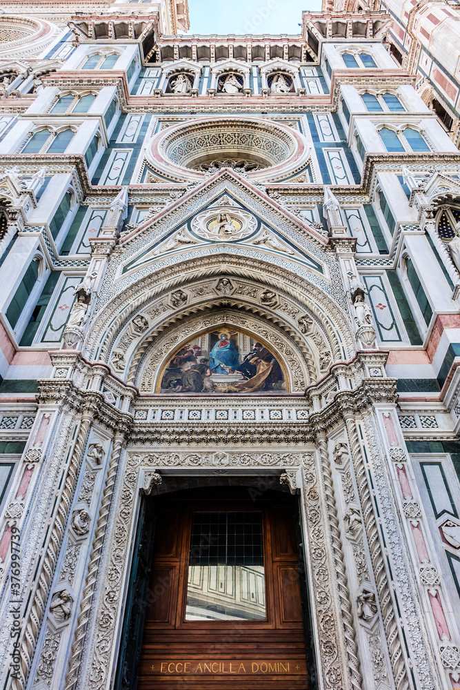 Cathedral Santa Maria del Fiore (or Duomo di Firenze), was built between 1296 and 1436. Cathedral is one of largest in world. Architectural fragments of front facade. Piazza del Duomo, Florence, Italy Cathedral Santa Maria del Fiore (or Duomo di Firenze), was built between 1296 and 1436. Cathedral is one of largest in world. Architectural fragments of front facade. Piazza del Duomo, Florence, Italy