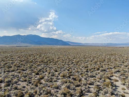 Aerial view of dusty dry desert land and mountain on the background Lee Vining Mono County, California, USA