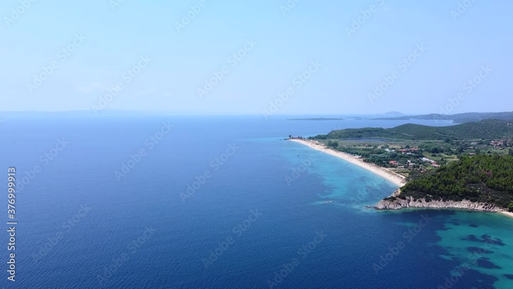 Seacoast with trees, vacation resort and sand beaches on blue clean tranquil sea. Aerial view Seacoast with trees, vacation resort and sand beaches on blue clean tranquil sea. Aerial view
