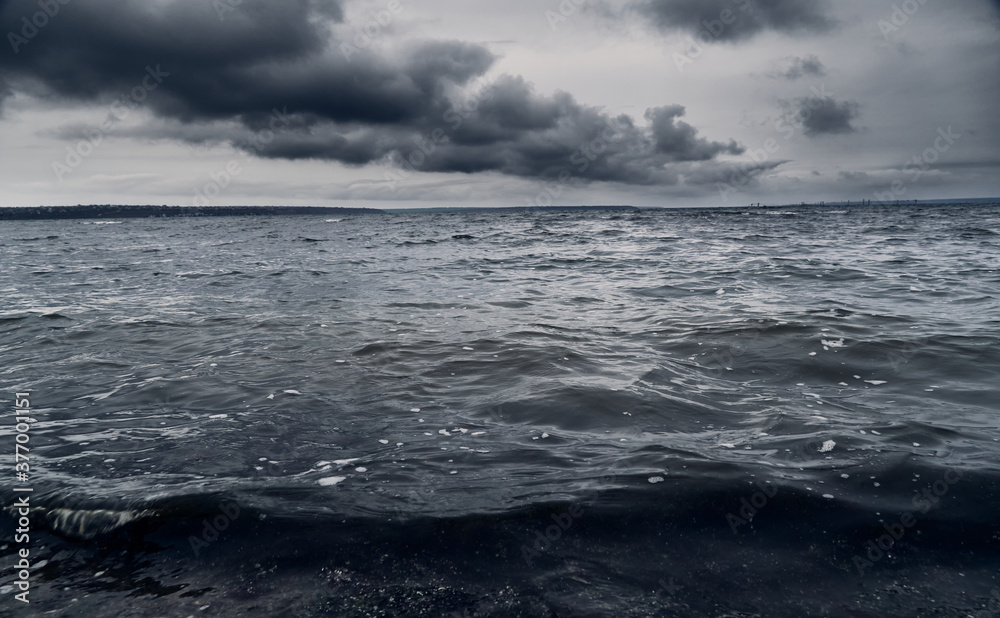 dark stormy sea and dramatic clouds, gloomy nature