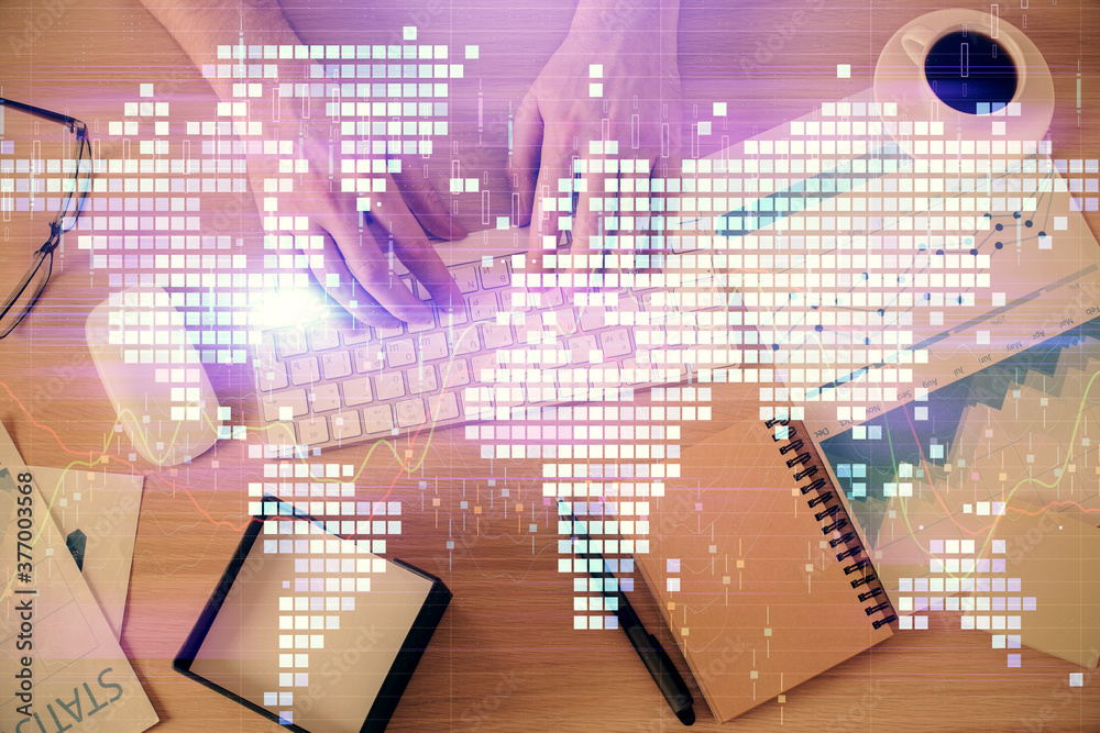 Double exposure of man's hands typing over computer keyboard and business theme hologram drawing. Top view. Financial markets concept. Double exposure of man's hands typing over computer keyboard and business theme hologram drawing. Top view. Financial markets concept.