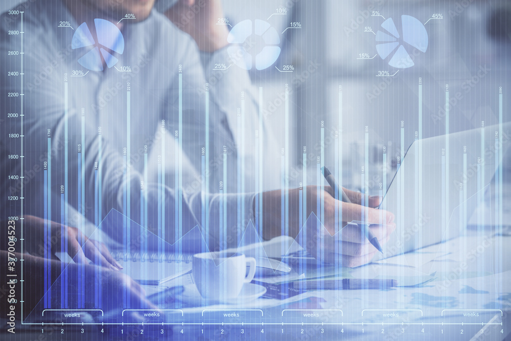 Double exposure of man and woman working together and financial graph hologram. Business concept. Computer background. Double exposure of man and woman working together and financial graph hologram. Business concept. Computer background.
