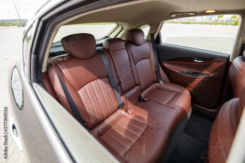 Brown leather seats in the new car. Interior upholstery with genuine leather.