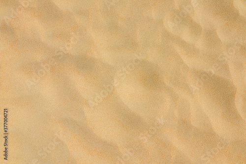Sand on the beach as background. Dune sand