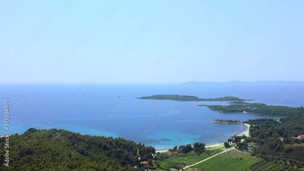 Seacoast with trees, vacation resort and sand beaches on blue clean tranquil sea. Aerial view Seacoast with trees, vacation resort and sand beaches on blue clean tranquil sea. Aerial view