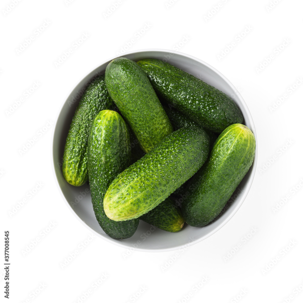 heap of fresh cucumbers in white ceramic bowl heap of fresh cucumbers in white ceramic bowl