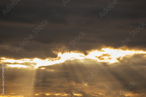 sun ray breaks through the clouds cityscape atmosphere colorful heaven