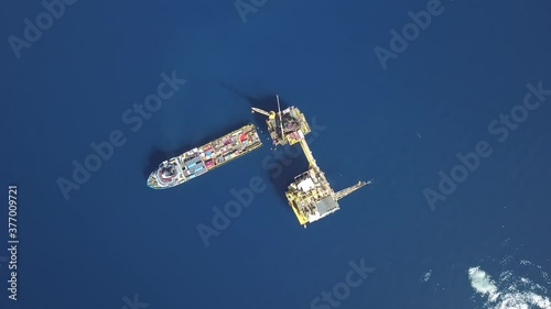 Support vessel for a rig less unit over the offshore production platform
 photo