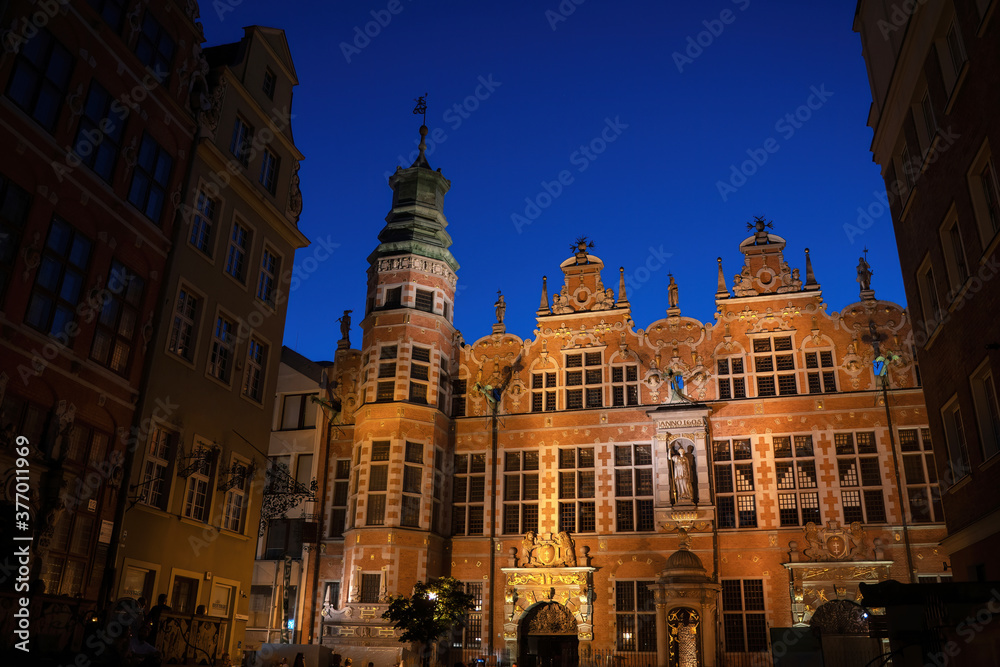 Gdansk, North Poland : Wide angle night shot of a Long Lane street in Old town displaying Polish architecture against clear blue night sky