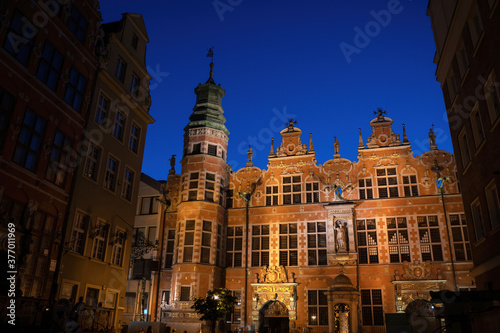 Gdansk, North Poland : Wide angle night shot of a Long Lane street in Old town displaying Polish architecture against clear blue night sky