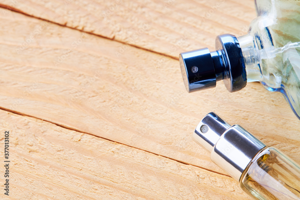 man perfume bottle over wooden desk background. studio shot. above view man perfume bottle over wooden desk background. studio shot. above view