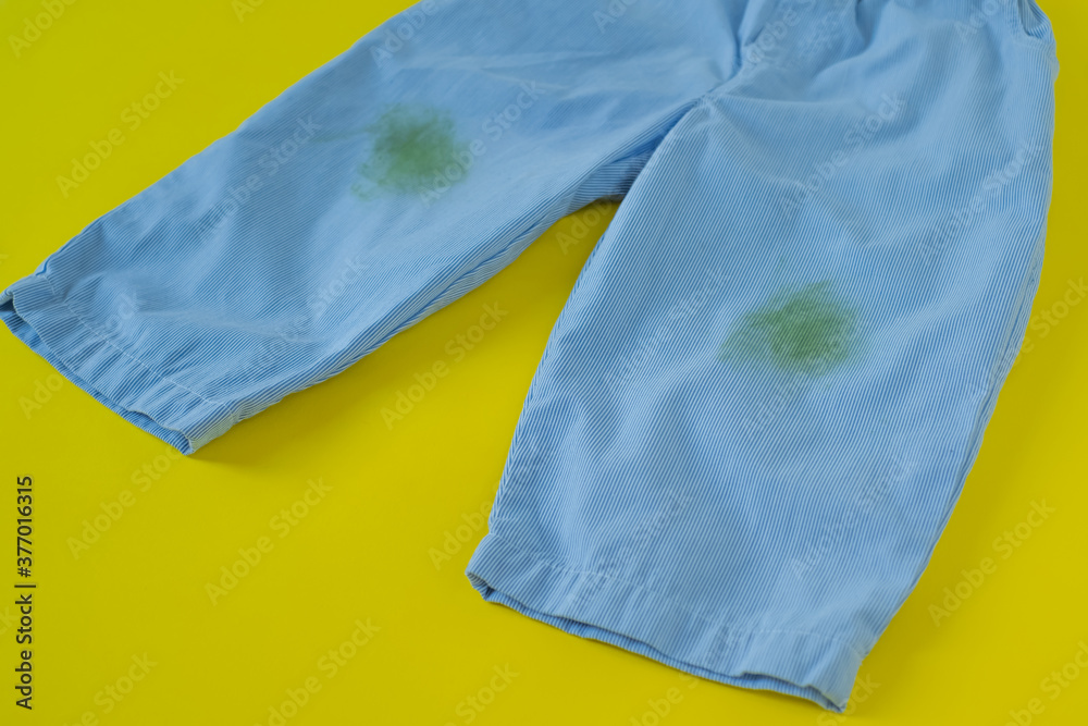 grass stains on pants.isolated on yellow background