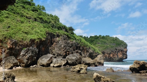The south coast along the Gunungkidul Regency of Yogyakarta is decorated with beautiful rocks and strong waves
