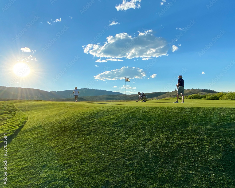 Playing golf in Colorado on a beautiful sunny day