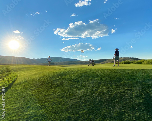 Playing golf in Colorado on a beautiful sunny day