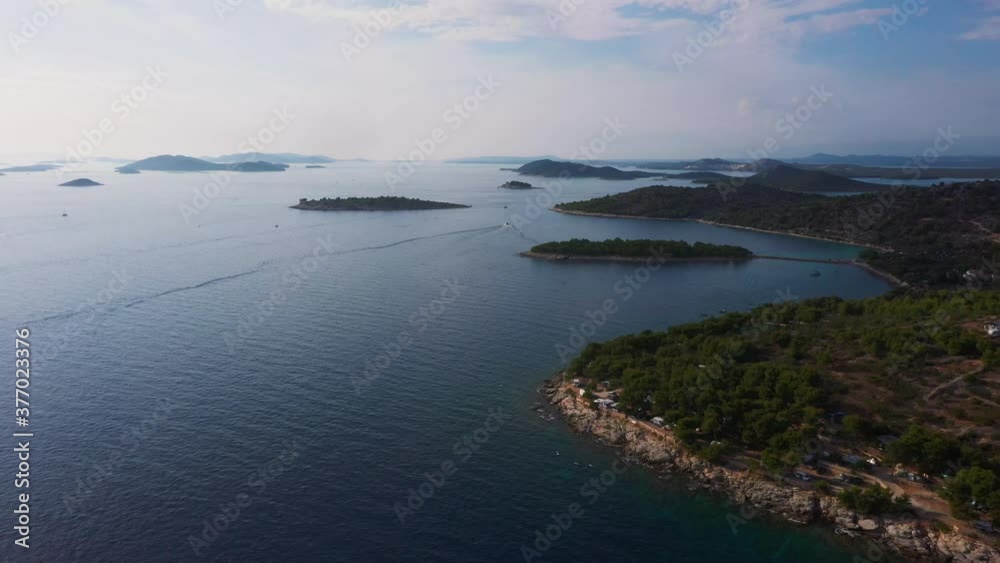 Stunning aerial view flying forward across coastline of Dalmatia, Croatia filmed in 4k with clear water, beaches and rocky shore of the Adriatic Sea. Stunning aerial view flying forward across coastline of Dalmatia, Croatia filmed in 4k with clear water, beaches and rocky shore of the Adriatic Sea.