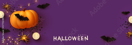 Happy Halloween banner. Festive background with realistic 3d orange pumpkins and flying bats, golden spider, candles, light garlands. Horizontal holiday poster, header for website. Vector illustration
