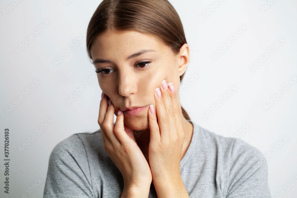 Close up of a beautiful young woman experiencing a painful toothache Close up of a beautiful young woman experiencing a painful toothache