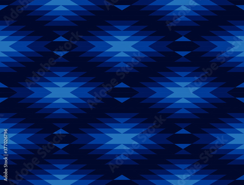 Tribal and ethnic pattern in blue geometric triangle, seamless vector abstract background for fashion