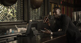 african american businessman relax and enjoy drink beer at counter bar