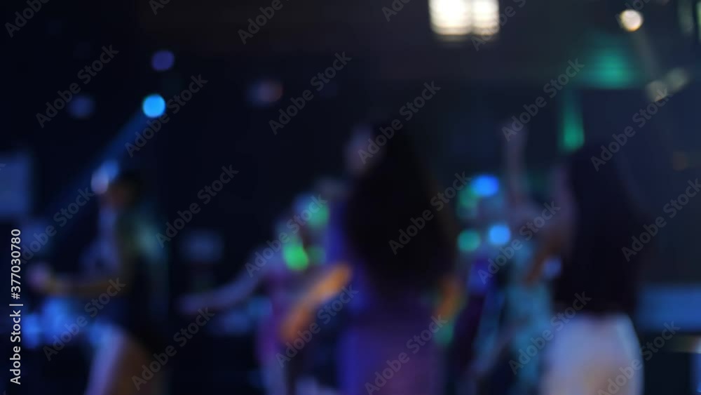 Blurred Crowd are having fun dancing in club. Nightlife and disco concept. Blurred Crowd are having fun dancing in club. Nightlife and disco concept.