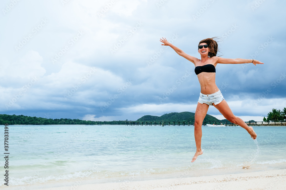 Funny woman playing on the beach. Vacation concept Funny woman playing on the beach. Vacation concept