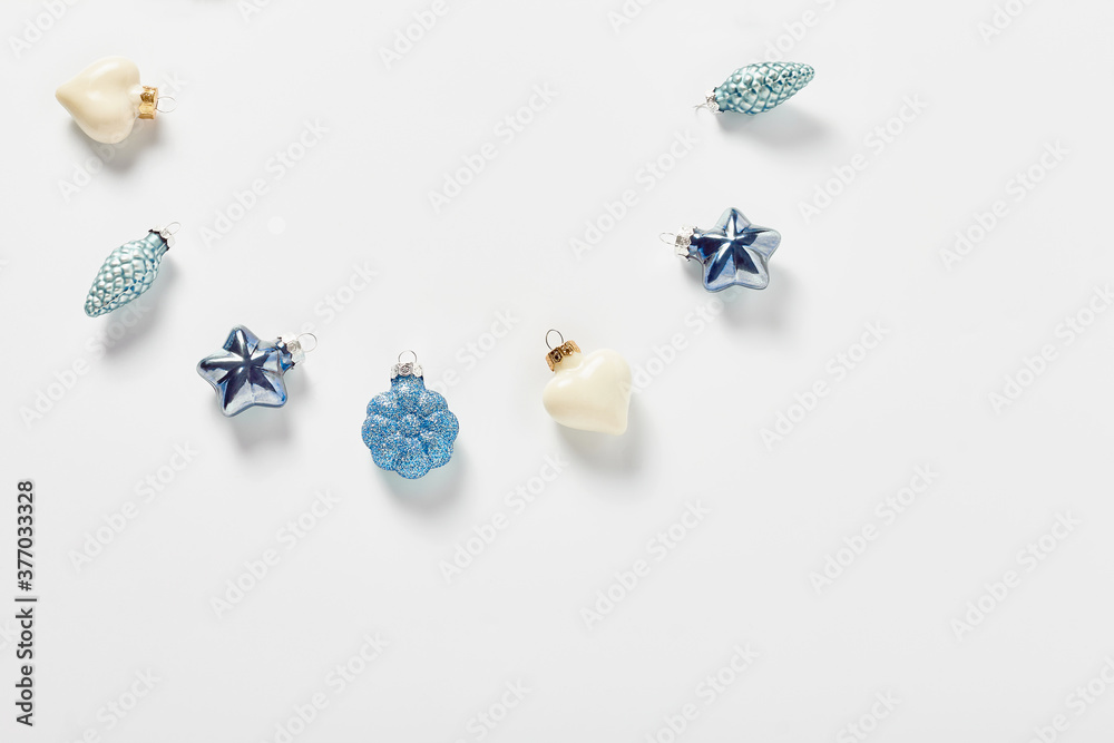 new year concept. Christmas decor in the form of pinecones, hearts, and stars in blue on a white background. flat lay, top view, copy space new year concept. Christmas decor in the form of pinecones, hearts, and stars in blue on a white background. flat lay, top view, copy space